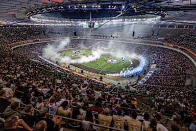 Spectacular drifting action thrills a packed crowd at the 2025 Red Bull Drift Masters Grand Finale in Warsaw, Poland, as smoke fills the stadium and competitors display high-octane skills