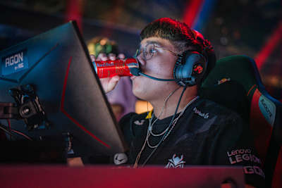 G2 Esports playerJawgemo wears a gaming headset and drinks Red Bull while competing on stage at Home Ground in Berlin, Germany, on November 22, 2024.