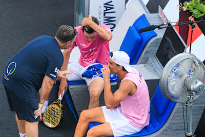 Juan Lebrón Chincoa and Franco Stupaczuk confer with their coach during the 2025 BNL Italy Major Premier Padel semifinal at the historic Foro Italico in Rome, Italy.