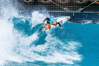 WSL Champion Caitlin Simmers of the United States surfs at the Surf Abu Dhabi Pro 2025 Quarterfinals on Hudayriyat Island, Abu Dhabi, powering through dynamic waves with Red Bull energy