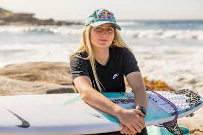 Rising star Sierra Kerr poses with her surfboard in Sydney, Australia. 