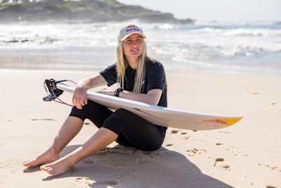 Sierra Kerr poses with her surfboard in Sydney, Australia.