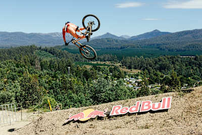 Jackson Goldstone launches into the air during practice at Red Bull Hardline 2026 in Maydena Bike Park, Australia.