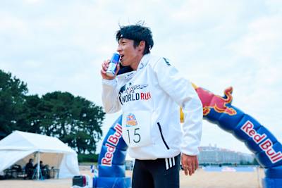 Jo Fukuda celebrates crossing the finish at Red Bull Sazanso 2025 in Fukuoka-shi, Japan, with a can of Red Bull 