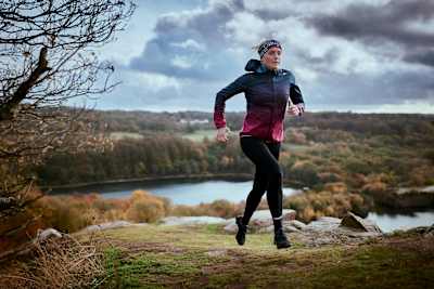 Camilla Pedersen running on trails around Opalsøen Lake, Denmark.