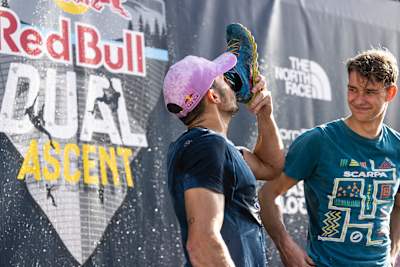 Alberto Ginés López marks the prize ceremony by drinking from his shoe at Red Bull Dual Ascent 2022 in Verzasca, Switzerland.
