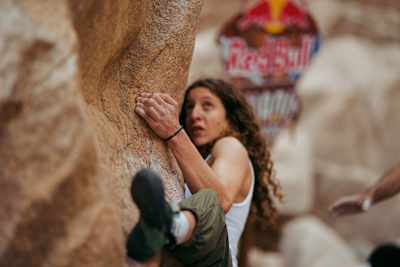 An athlete scales rugged rocks at Red Bull Wadi Ascent 2026 in Dahab, Egypt.