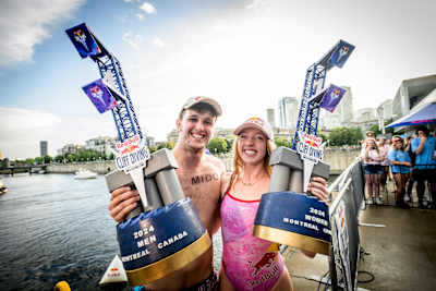 Aidan Heslop and Molly Carlson celebrate with their Red Bull Cliff Diving Montreal World Series event win trophies in 2024