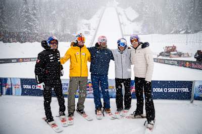 Captains stand on skis, posing before the snowy ski jump at Red Bull Target Jumping 2026 in Zakopane, Poland, embracing the adventurous Red Bull spirit on April 1, 2026.