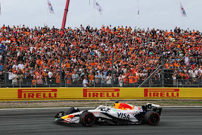Third placed Isack Hadjar celebrates on his way to parc ferme during the F1 Grand Prix of Netherlands at Circuit Zandvoort on August 31, 2025 in Zandvoort, Netherlands.