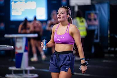 A HYROX competitor drinks a can of Red Bull at Red Bull Night Shift Olympia in London, United Kingdom in March 2026.