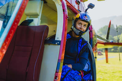 Wingsuit pilot Amber Forte inside a helicopter preparing for a flight