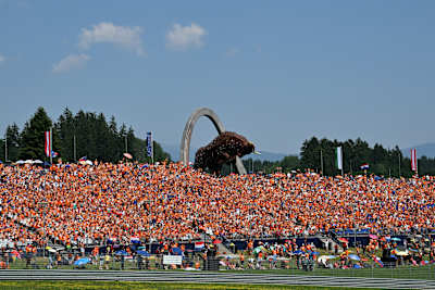 A grandstand full of orange-clad fans of Max Verstappen of the Netherlands and Oracle Red Bull Racing during the F1 Grand Prix of Austria at Red Bull Ring.