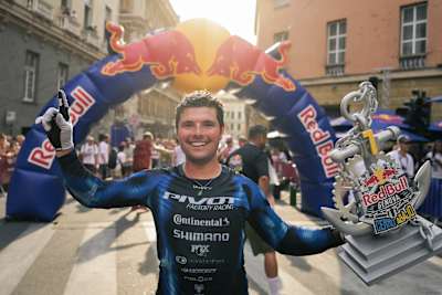 Roger Vieira beams with pride while holding the winner's trophy at Red Bull Genova Cerro Abajo 2026. 