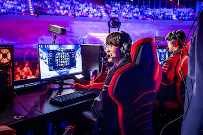 T1 team players face off in the Red Bull League of Its Own esports event in Berlin, Germany, on December 9, 2023, with thrilling action and vibrant stage lighting