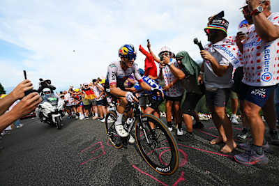 Florian Lipowitz climbing during stage 15