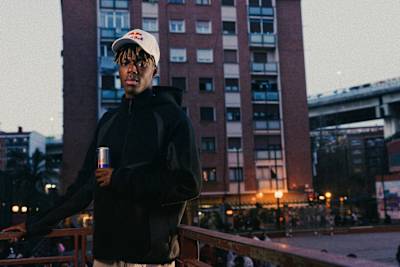 Captured in Bilbao, Spain, in 2026, Nico Williams poses with a can of Red Bull against a cityscape backdrop