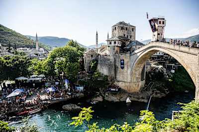 On 5 September 2025, Romania’s Constantin Popovici dives from the 27.5-metre platform on Stari Most during the Red Bull Cliff Diving World Series in Mostar, Bosnia and Herzegovina