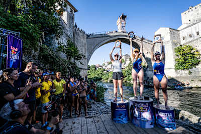 Rhiannan Iffland, Molly Carlson and Ellie Smart celebrate on the podium during the Red Bull Cliff Diving World Series in Mostar, Bosnia and Herzegovina, on 9 September 2023