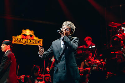 Trueno takes centre stage with a live vocal performance alongside the orchestra at Red Bull Symphonic in Buenos Aires, Argentina, September 2025