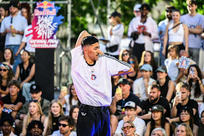Dancer Zax delivers an energetic performance at the Red Bull Dance Your Style National Final 2026, held at Barfuesserplatz, Basel, Switzerland, captivating the lively crowd.