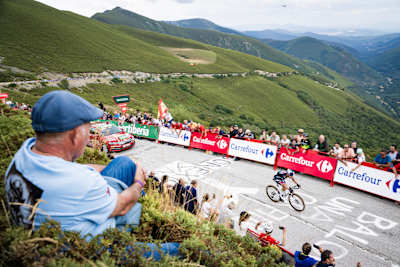 Primož Roglič of Red Bull-BORA-hansgrohe climbs Puerto de Ancares ahead of Ben O'Connor during stage 13 of La Vuelta 2024 in Spain.