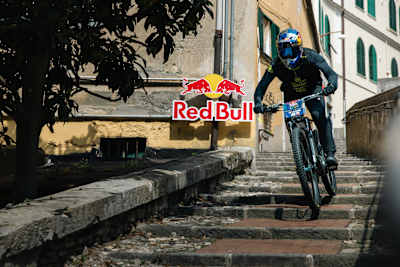 Tomáš Slavík rides down the historic stone steps during Red Bull Cerro Abajo in Genova, Italy, on 24 August 2025, near Teatro Nazionale Genova.