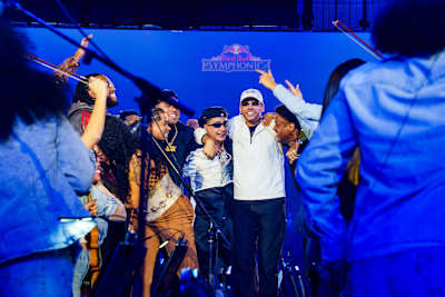 MC Hariel celebrates during Red Bull Symphonic in São Paulo, Brazil, on 8 August 2026, surrounded by fellow performers.