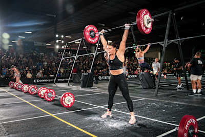 Laura Horváth powers through an overhead lift on day three of the 2025 World Fitness Project Tour Stop 2 in Mesa, Arizona.