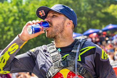 Sam Sunderland drinks Red Bull during the fourth off-road day at Red Bull Romaniacs in Sibiu, Romania, on 1 August 2026