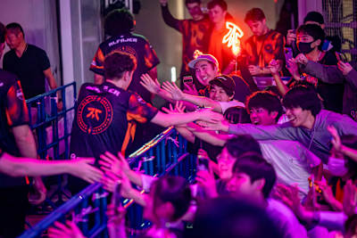 Spectators reach out to FNATIC players during day 3 of Red Bull Home Ground in Tokyo, Japan on November 5, 2023