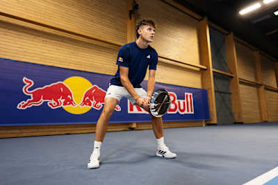 Jakub Menšík prepares for action on an indoor court in Prague, Czech Republic. 