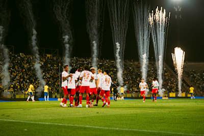 RB Leipzig players gather on the pitch as fireworks light up their friendly against Mamelodi Sundowns in Pretoria, South Africa, on 29 May 2026