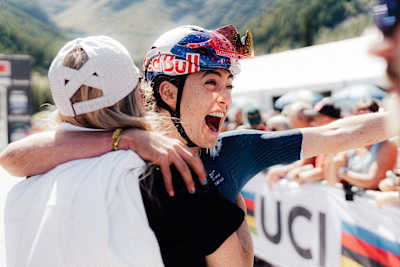 Kate Courtney celebrates winning the UCI MTB World Championships in Valais, Switzerland on Septemeber 6, 2025.