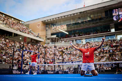 Arturo Coello celebrates during the Premier Padel Major Paris final in Paris, France, on 13 September 2026, as the crowd erupts around the blue court.