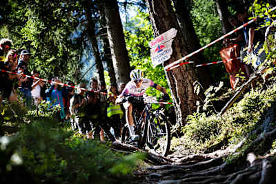 Mario Bair powers through the forest course during Red Bull Dolomitenmann 2026 in Lienz, Austria.