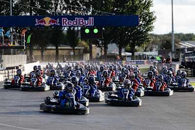 Drivers line up in go-karts beneath the Red Bull gantry during Red Bull MAX vs 100 at Silverstone, Great Britain, on September 16, 2026