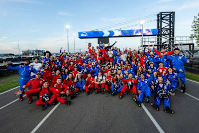 Drivers celebrate together during Red Bull Max vs 100 at Silverstone, Great Britain, on September 16, 2026, beneath the event’s Disney+ and Max branding