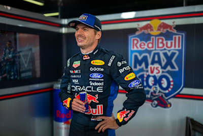 Max Verstappen smiles in his Red Bull Racing suit while holding a can during the Red Bull ‘Max vs 100’ event at Silverstone, Great Britain, on 16 September 2026.