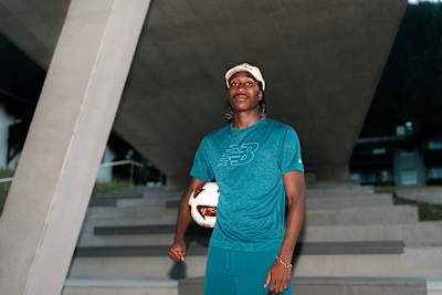 Yan Diomandé poses with a football during a portrait photoshoot in Saalfelden, Austria, in 2026, wearing New Balance apparel.