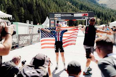 Kate Courtney celebrates winning the UCI MTB World Championships in Valais, Switzerland on Septemeber 6, 2025