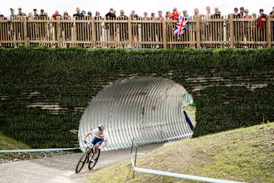 Tom Pidcock powers through the course at the UCI XCO World Championships in Glentress, Scotland, on 12 August 2023, watched by cheering fans