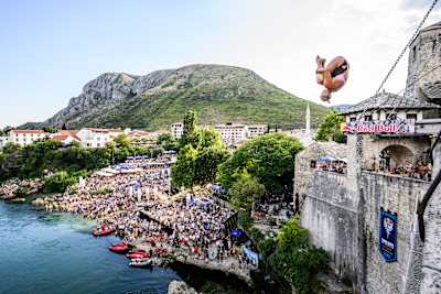 Rhiannan Iffland of Australia launches from the 21.5-metre platform on Stari Most during the 2026 Red Bull Cliff Diving World Series in Mostar, Bosnia and Herzegovina