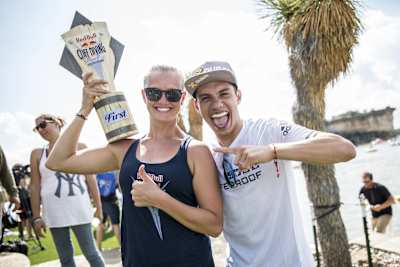 Women's winner Rhiannan Iffland (L) of Australia and men's winner Jonathan Paredes of Mexico celebrate during the first stop of the Red Bull Cliff Diving World Series, Possum Kingdom Lake, Texas, USA