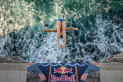 On 25 September 2026, Romania’s Constantin Popovici dives from the 26-metre balcony during the first round of the Red Bull Cliff Diving World Series final stop in Polignano a Mare, Italy