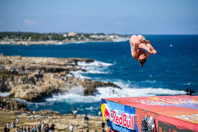 Molly Carlson of Canada performs a spectacular dive from the 22-metre platform during the Red Bull Cliff Diving World Series final stop in Polignano a Mare, Italy, on 26 September 2026