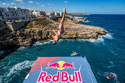 Aidan Heslop of the UK launches from the 27-metre platform during the Red Bull Cliff Diving World Series 2026 in Polignano a Mare, Italy, on 26 September