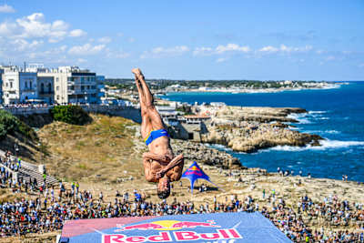 Oleksiy Prygorov of Ukraine performs a spectacular dive from the 27-metre platform at the 2026 Red Bull Cliff Diving World Series final in Polignano a Mare, Italy