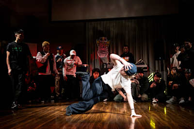 B-Girl Kimie of France performs a dynamic move during an exhibition battle at Chross Cross in Hirosaki, Japan, during the 2025 Red Bull BC One All Star Tour Japan