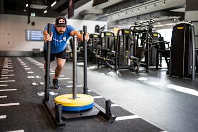 Luka Đukić pushes a weighted sled during a training session in Tivat, Montenegro.
